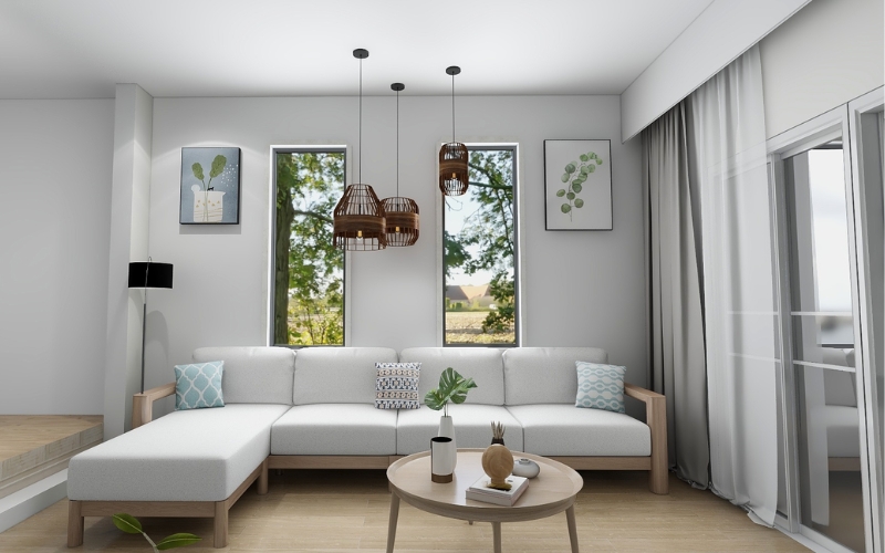 Sử dụng sofa chữ L nhỏ gọn bàn trà kính và tranh treo tường tạo điểm nhấn