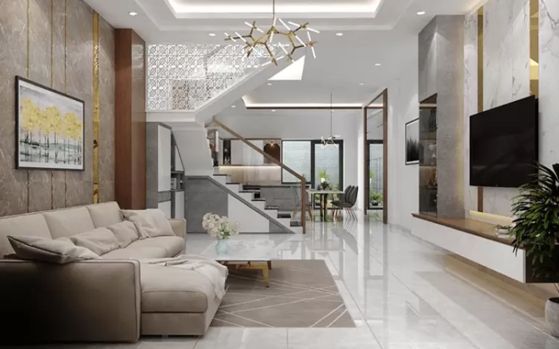 Bố trí sofa, bàn trà và tivi gọn gàng, tối ưu không gian di chuyển, giúp phòng khách nhà ống rộng rãi hơn