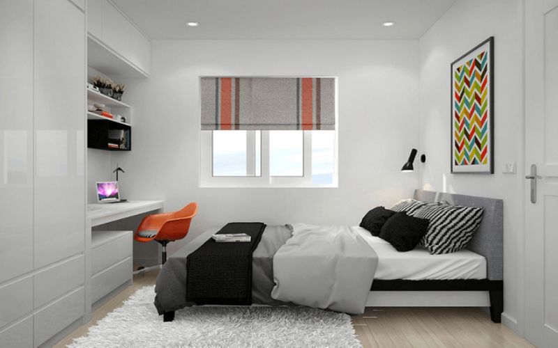 Giường ngủ được bố trí gần cửa sổ đón ánh sáng, tủ quần áo và bàn làm việc đặt sát tường